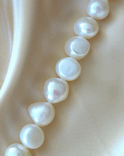 Baroque freshwater pearl bracelet with 925 sterling silver from Ultramarine Birch, featuring irregularly shaped pearls and silver clasp.