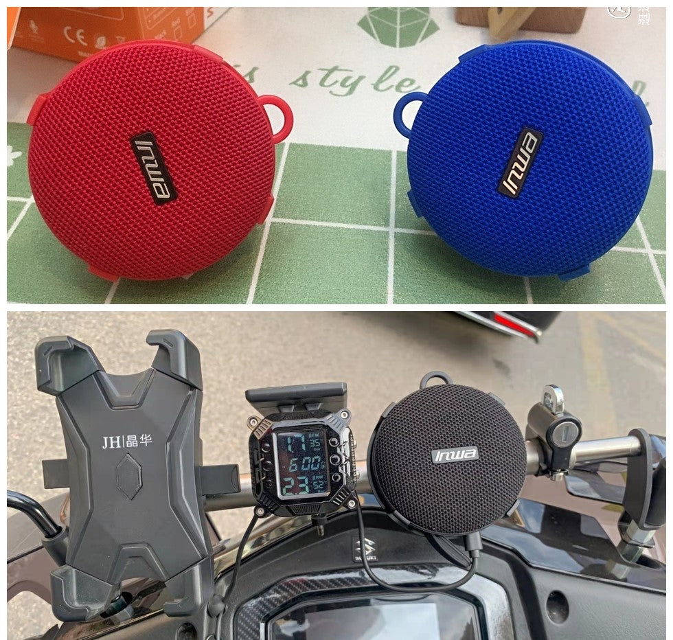 Lilac Milo IPX7 waterproof portable sport Bluetooth speaker with bike mount, showing the compact black speaker attached to a bike handlebar.