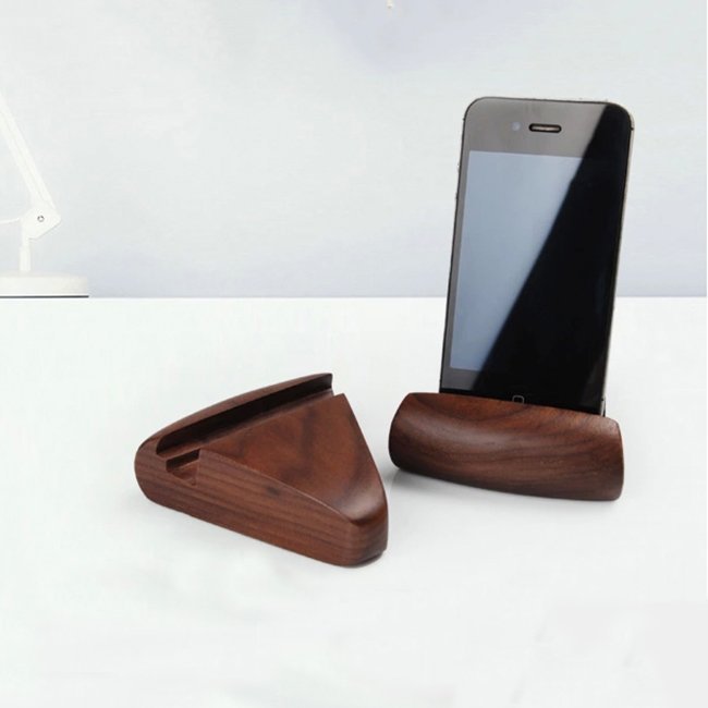 Fuchsia Molly walnut phone stand for home and garden, showcasing a smooth, polished wooden design holding a smartphone.
