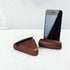 Fuchsia Molly walnut phone stand for home and garden, showcasing a smooth, polished wooden design holding a smartphone.