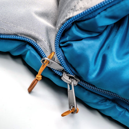 Indigo Eurybia Camfy 30 sleeping bag for camping, shown in outdoor setting with zipper and insulated design.