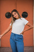 Lavender Danae DT Alyssa Rib Knit Split Hem Tee in white, shown as a stylish ribbed knit top with a split hem detail.