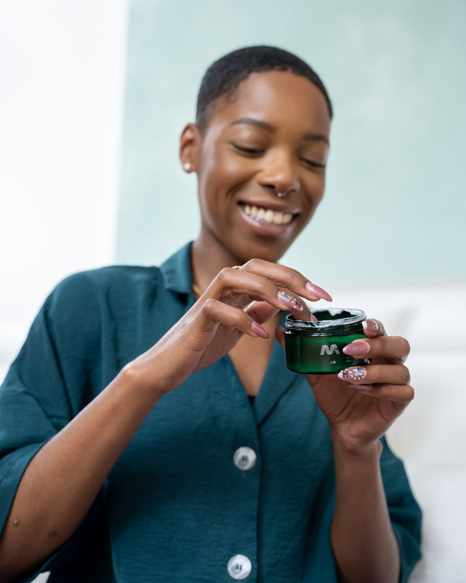 Green Saffron Mekabu Hydrating Styling Cream for hair, with a soft, creamy texture and natural ingredients visible in the image.