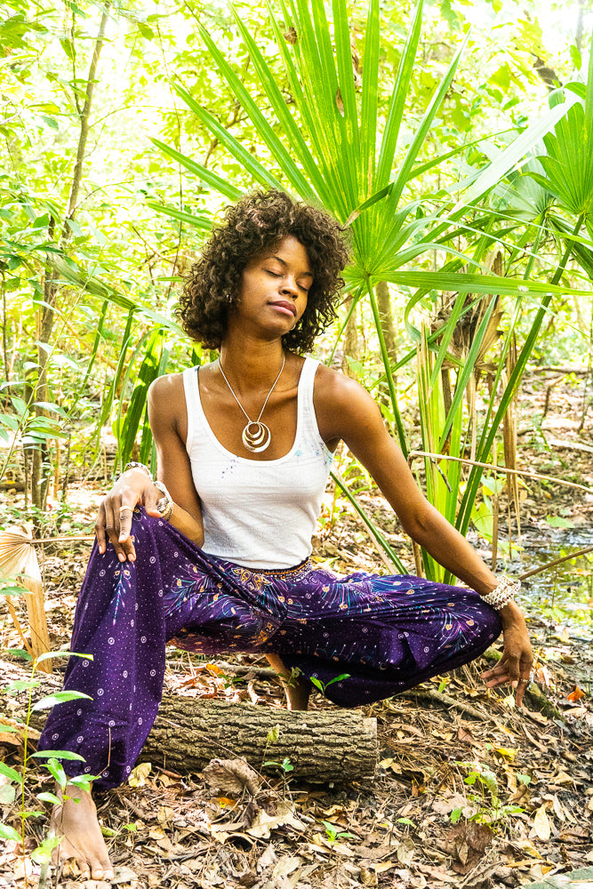 Purple PEACOCK harem pants for women by Tan Smokey, boho style with flowing, loose-fit hippie pants featuring peacock patterns.