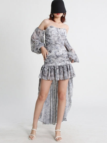 Mauve Ananke asymmetrical mini dress with slash neckline and puff sleeves, solid minimalist design, displayed on a hanger.