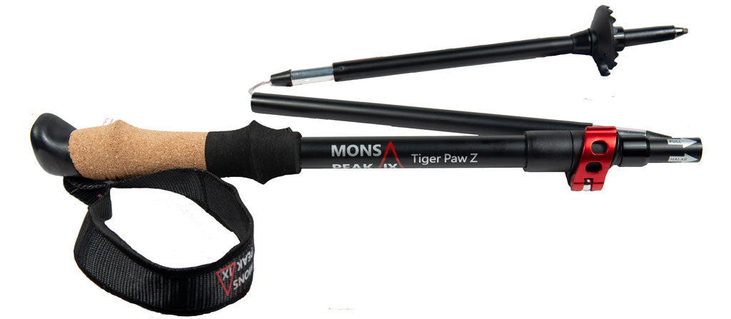 Triangulum Mons Peak IX Tiger Paw Z trekking poles with ergonomic grips and adjustable shafts for hiking and trekking adventures.