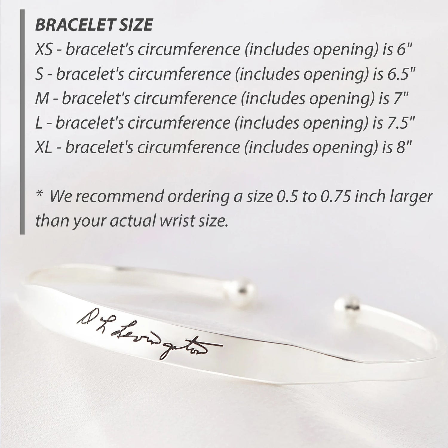 Green Millie handwritten cuff bracelet cufflinks featuring elegant script design on polished metal surfaces.