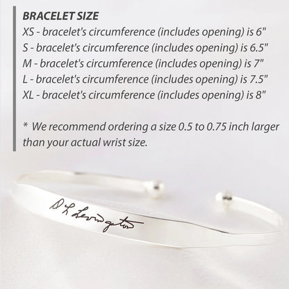 Green Millie handwritten cuff bracelet cufflinks featuring elegant script design on polished metal surfaces.