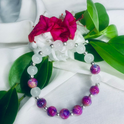 White and purple stone stretch bracelet with silver spacers by Tan Saffron, showcasing smooth, polished gemstones and elegant silver accents.