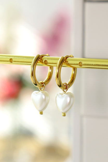 Ultramarine Birch 24K Pearl Hearts Hoop Earrings featuring gold hoops adorned with pearl heart charms.