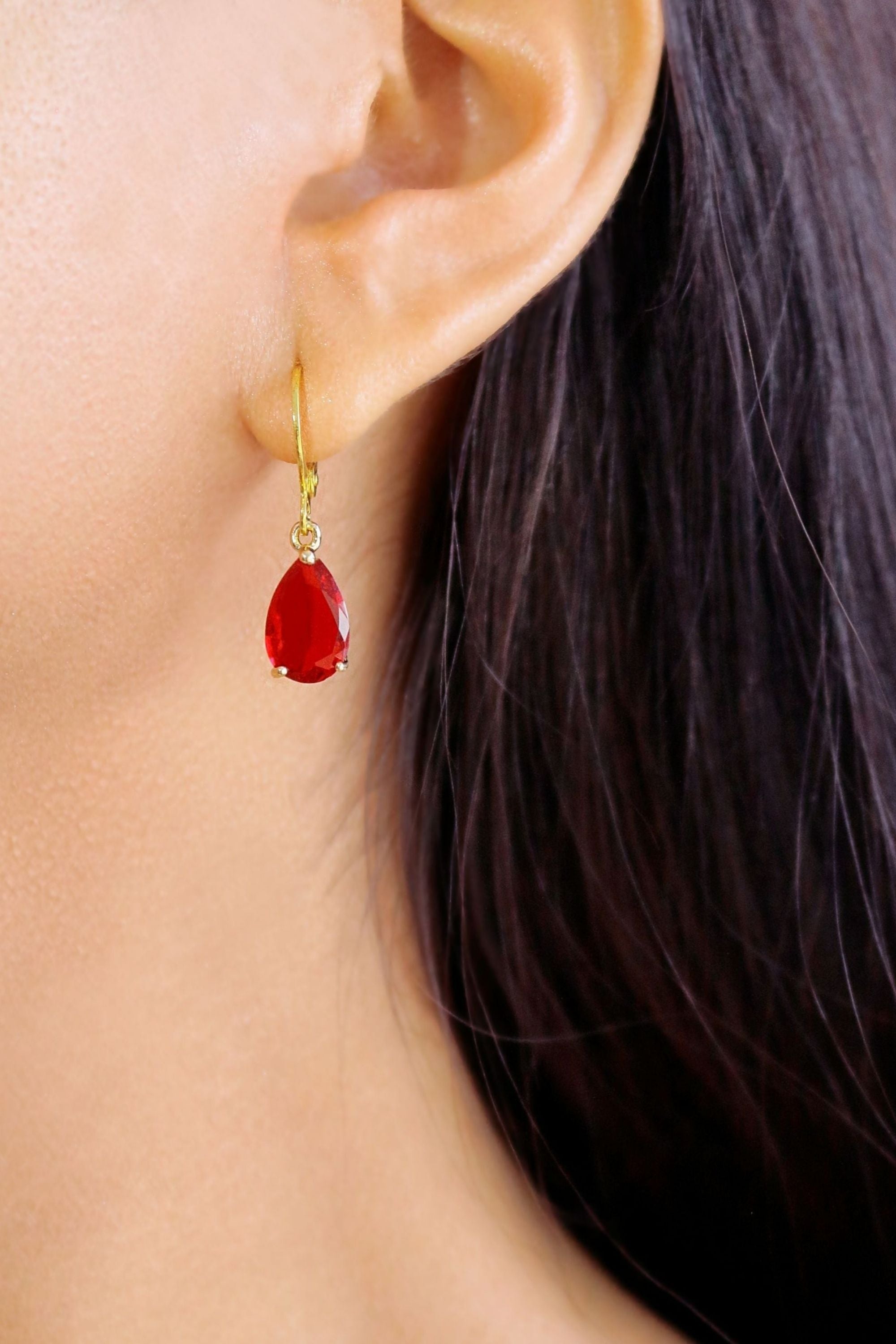 Ultramarine Birch 18K rainbow teardrop hoop earrings with colorful, polished gold finish and elegant teardrop shape.