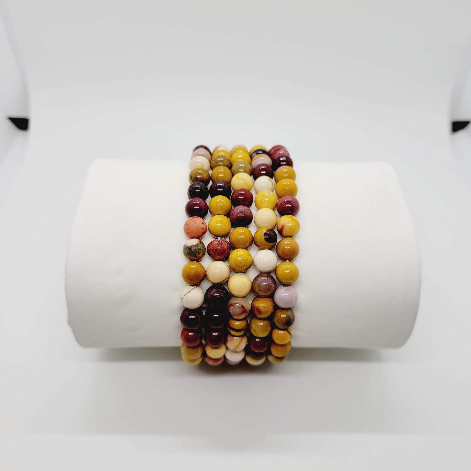 Olive Coeus Mookite stone bracelets featuring metaphysical and Reiki healing elements, boho style with natural earthy tones.