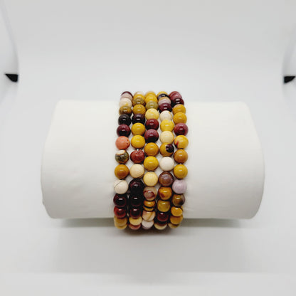 Olive Coeus Mookite stone bracelets featuring metaphysical and Reiki healing elements, boho style with natural earthy tones.
