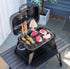 Yellow Pandora portable tabletop charcoal grill for kitchen use, compact design with grilling surface and vented lid.