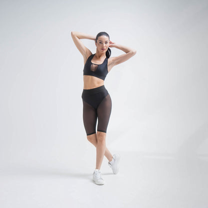 Black mesh shorts by Indigo Thalassa featuring breathable fabric and a relaxed fit, perfect for casual or athletic wear.