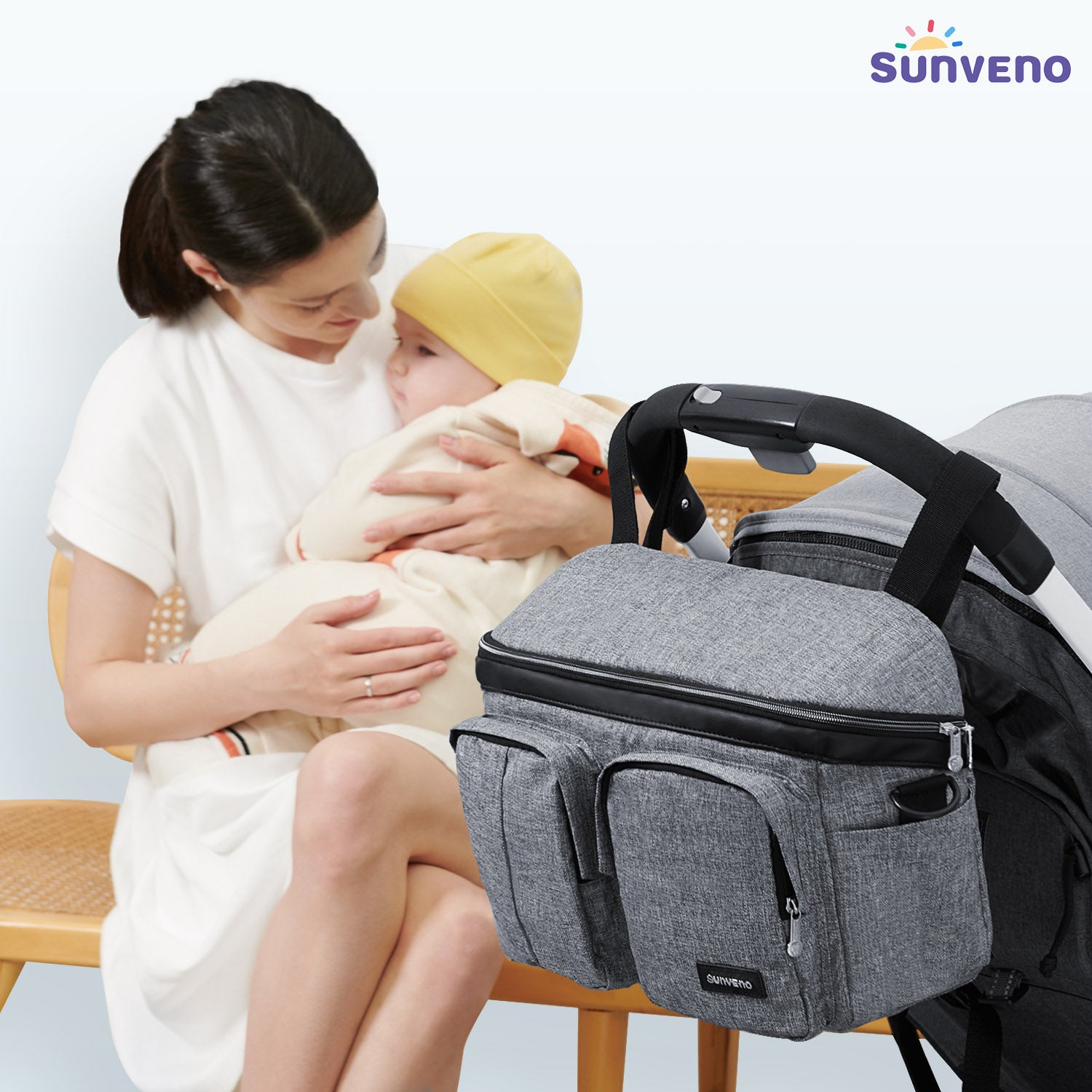 Maroon Chronos stroller organizer caddy bag with multiple compartments and adjustable straps, designed for parent convenience.