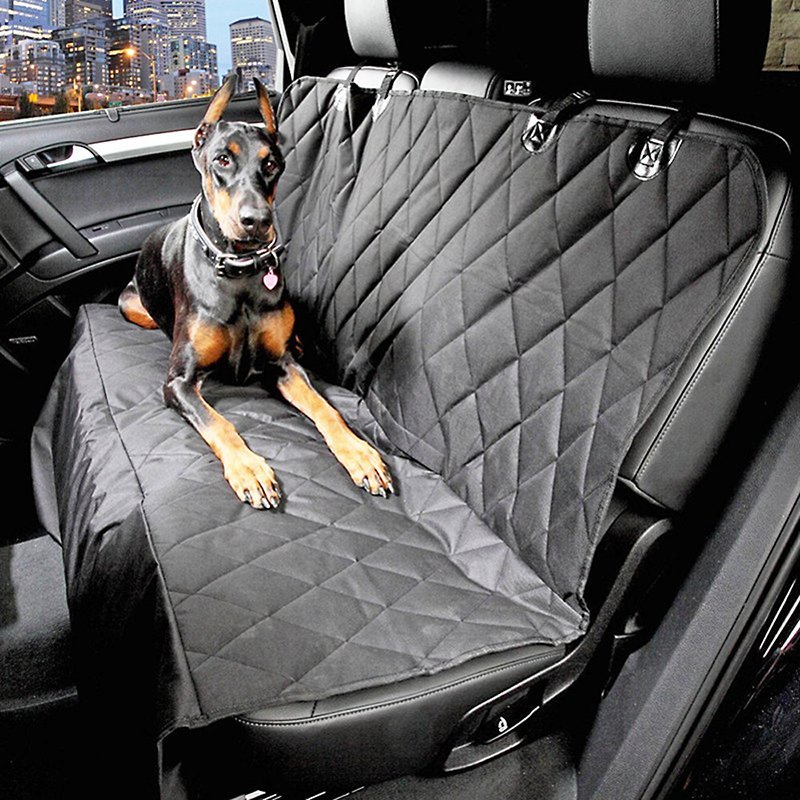 Fuchsia Molly automotive dog seat cover showing a durable, waterproof fabric with adjustable straps for car seat protection.