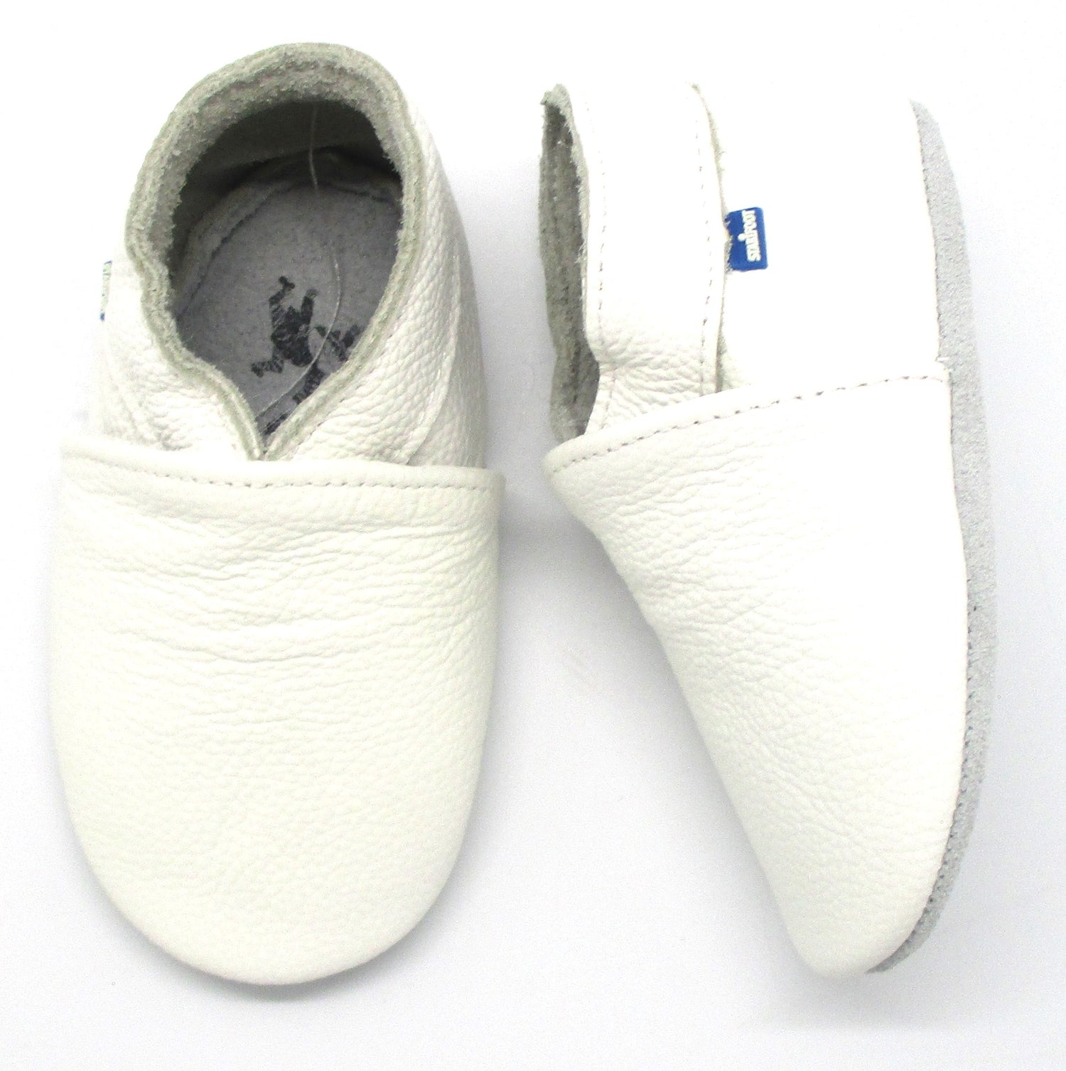 White BABYSOFT 3000 footwear by Puce Selene, showing the soft, comfortable baby shoes with a clean white design.