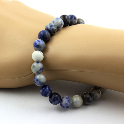 Sodalite and howlite beaded bracelet with 8mm beads from Tan Coconut, featuring blue and white stone accents.