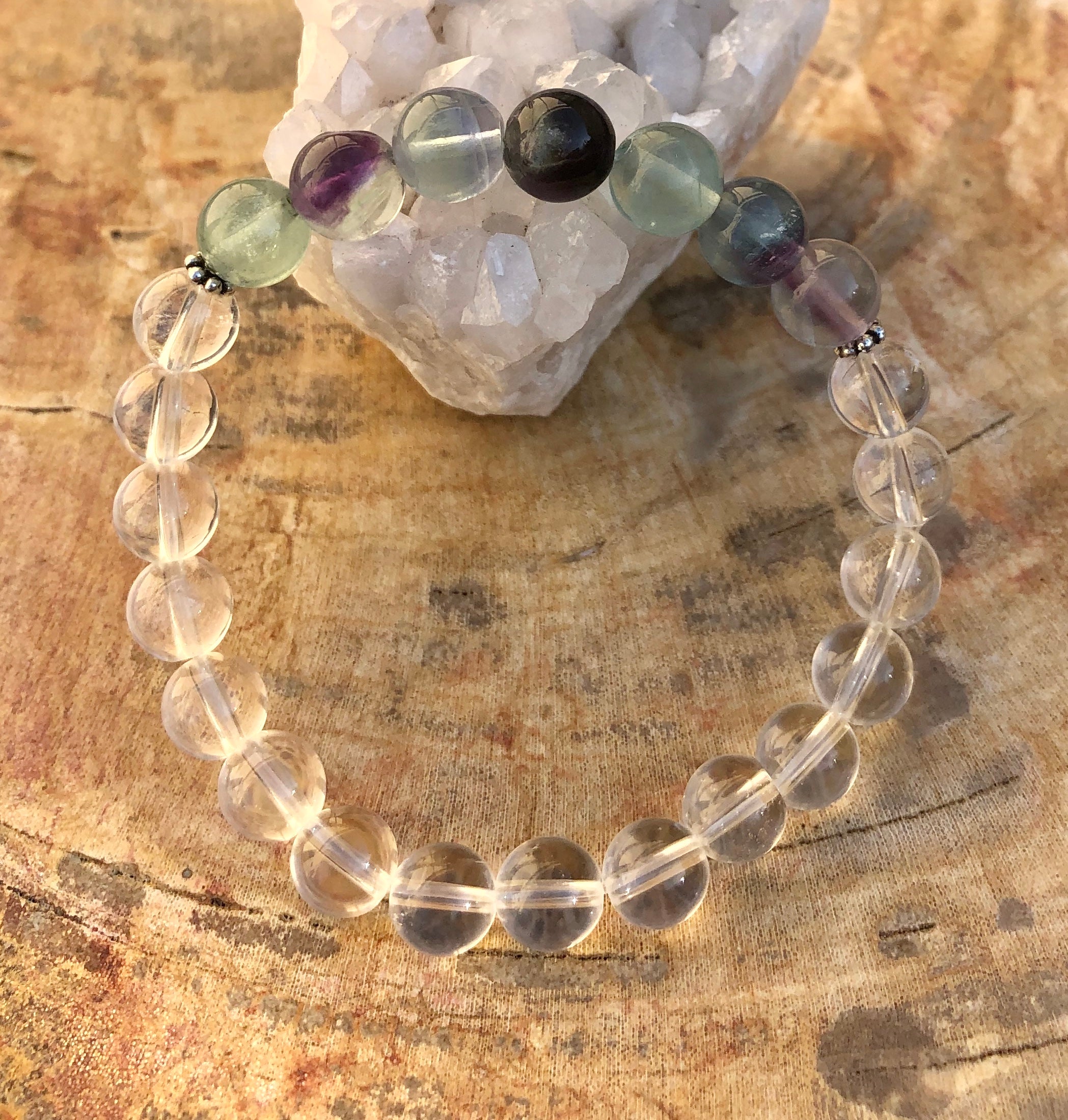 Rainbow Fluorite and Crystal Quartz stretch bracelet featuring natural gemstones, crafted by Violet Chaos.