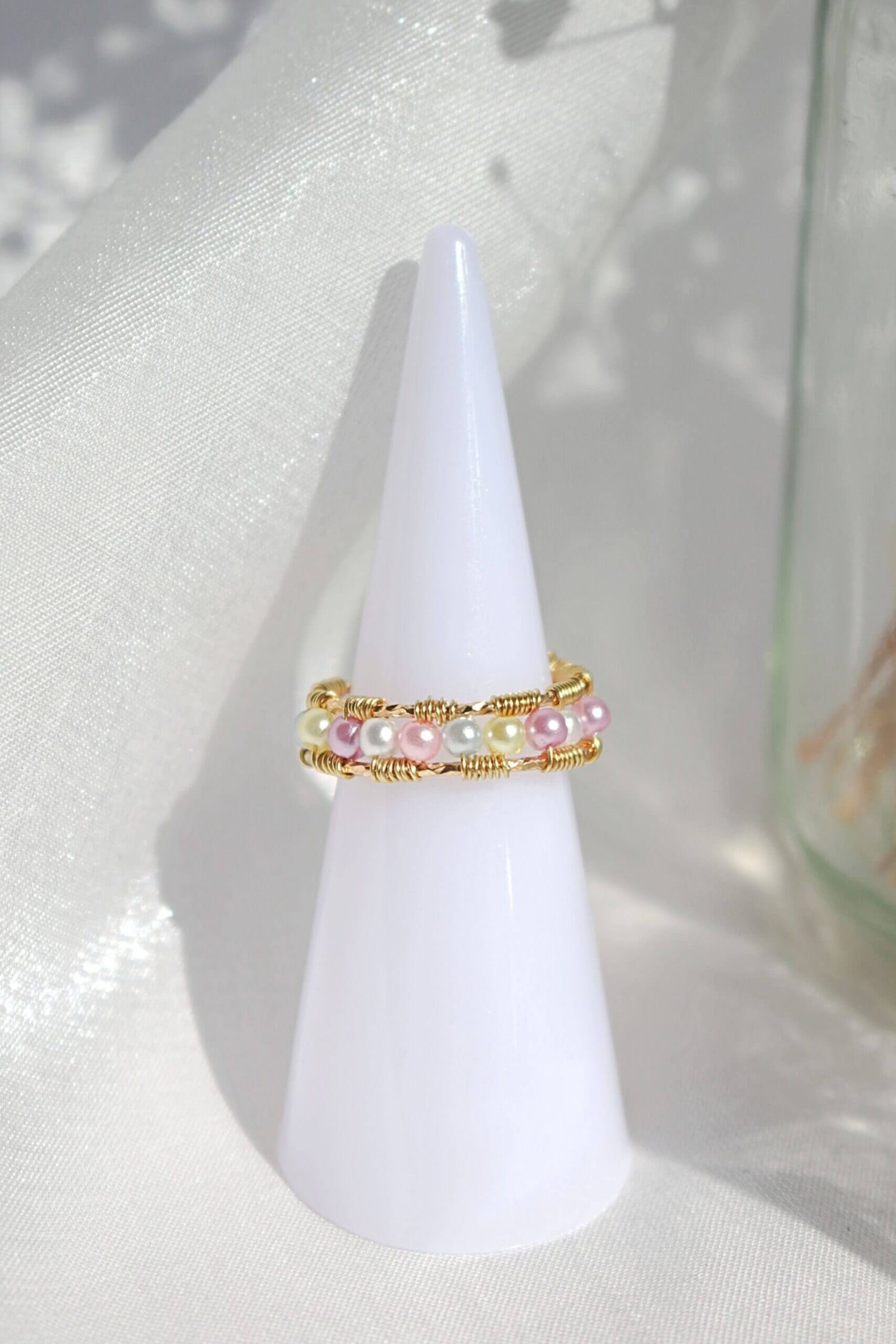 18 Karat Pastel Rainbow Hand Wired Band Ring by Ultramarine Birch, featuring colorful pastel gemstones and intricate wire wrapping.
