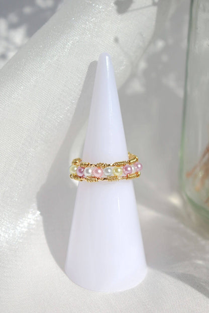 18 Karat Pastel Rainbow Hand Wired Band Ring by Ultramarine Birch, featuring colorful pastel gemstones and intricate wire wrapping.