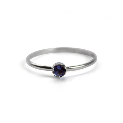 Sterling silver dainty solitaire ring featuring a polished Iolite gemstone, designed by Grey Clymene.