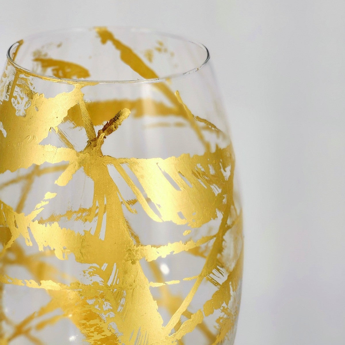 White Zeus Amaryllis 12-inch gold gilded glass bullet vase for elegant home decor, featuring a sleek, elongated shape with gold accents.