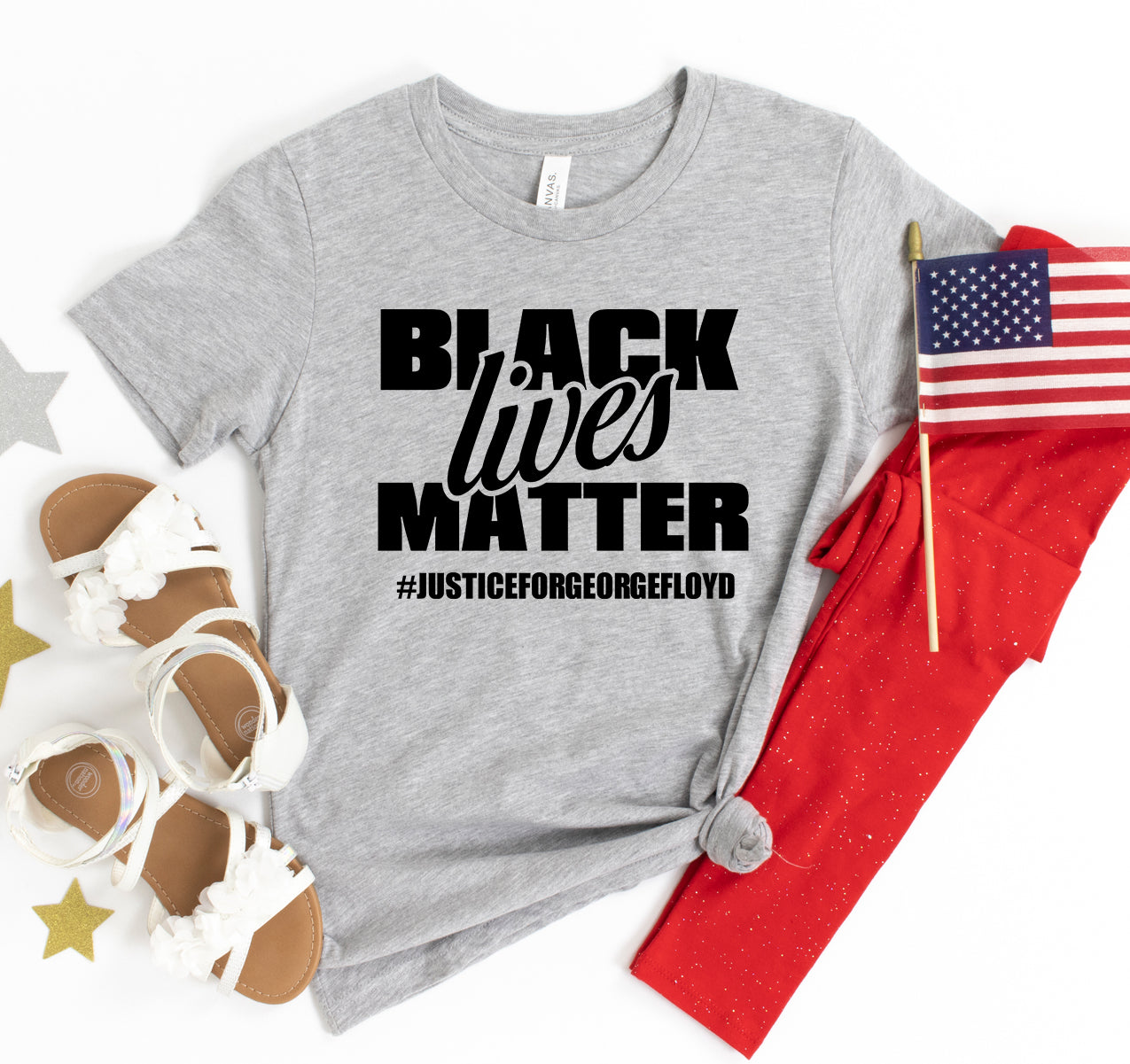 Black Lives Matter T-shirt by Agate featuring bold black and white graphic print on the front.