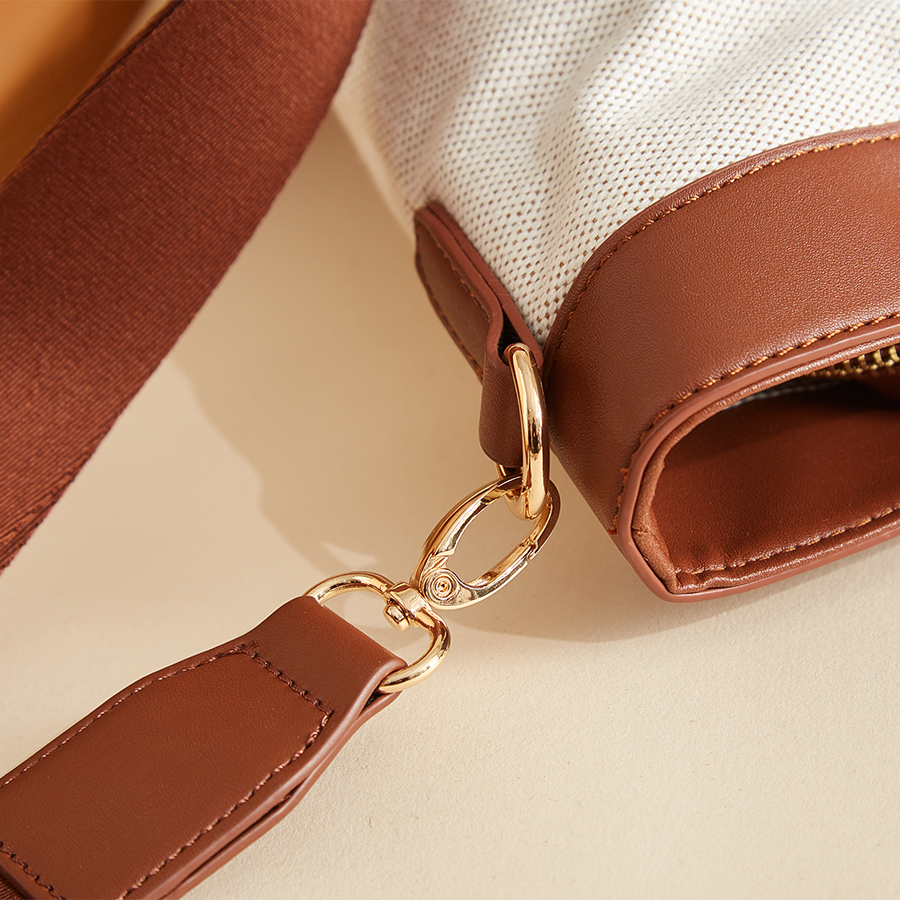 Maroon Chronos canvas tote diaper bag with multiple compartments and handles, designed for parenthood and accessories.