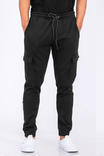Lime Milo cotton blend cargo joggers pants with multiple pockets and relaxed fit, shown in a neutral color.