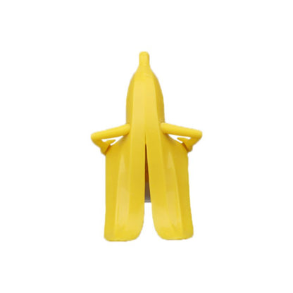 Fuchsia Molly Mr Banana bottle stopper for drinkware, featuring a yellow banana design to seal bottles and prevent spills.