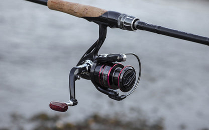 Teal Simba 8KG spinning reel handle with line spool for fishing, showing the metal handle and spool on a fishing reel.