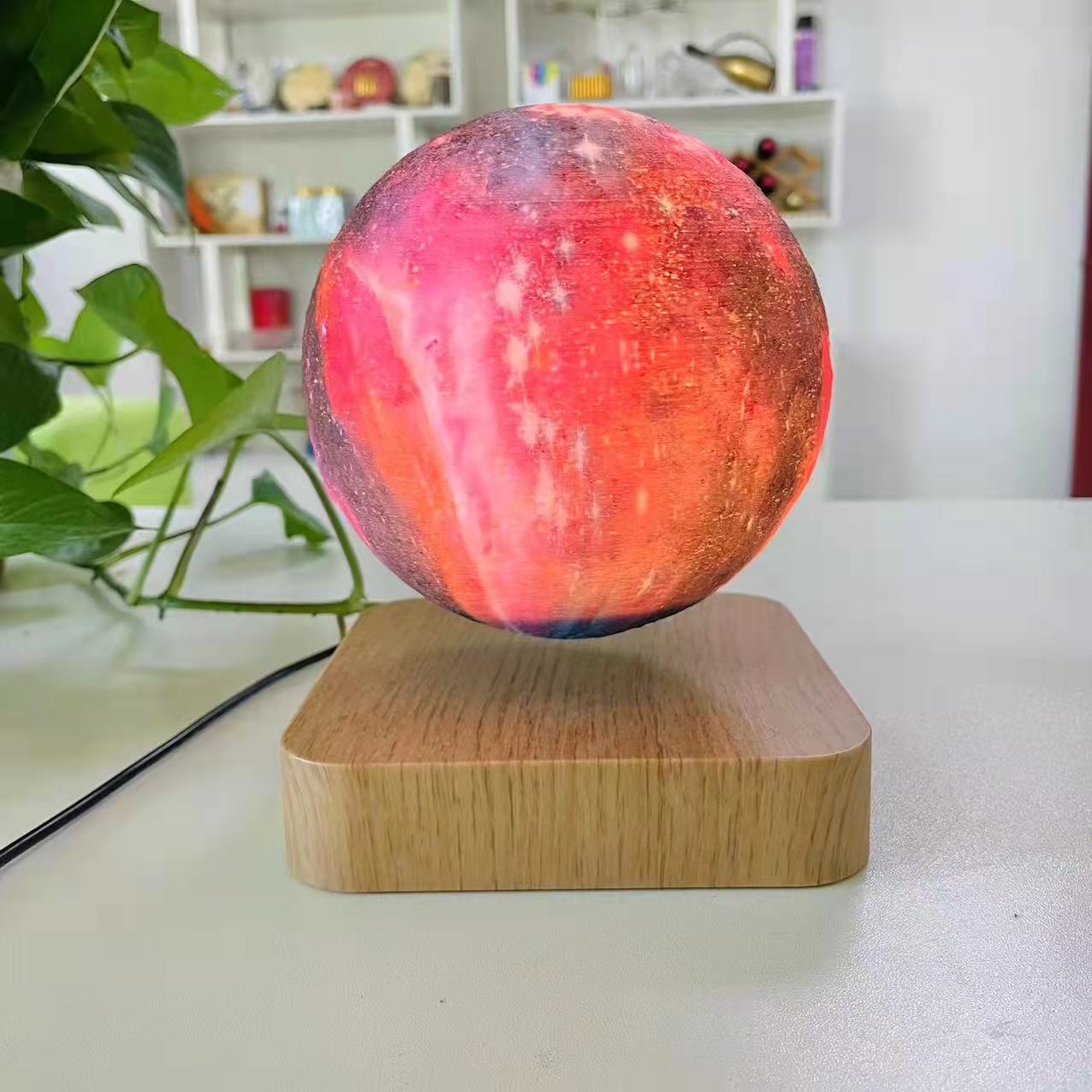 Teal Simba 3D printed moon lamp with touch control and magnetic levitation, used as a night lamp or decorative tech accessory.