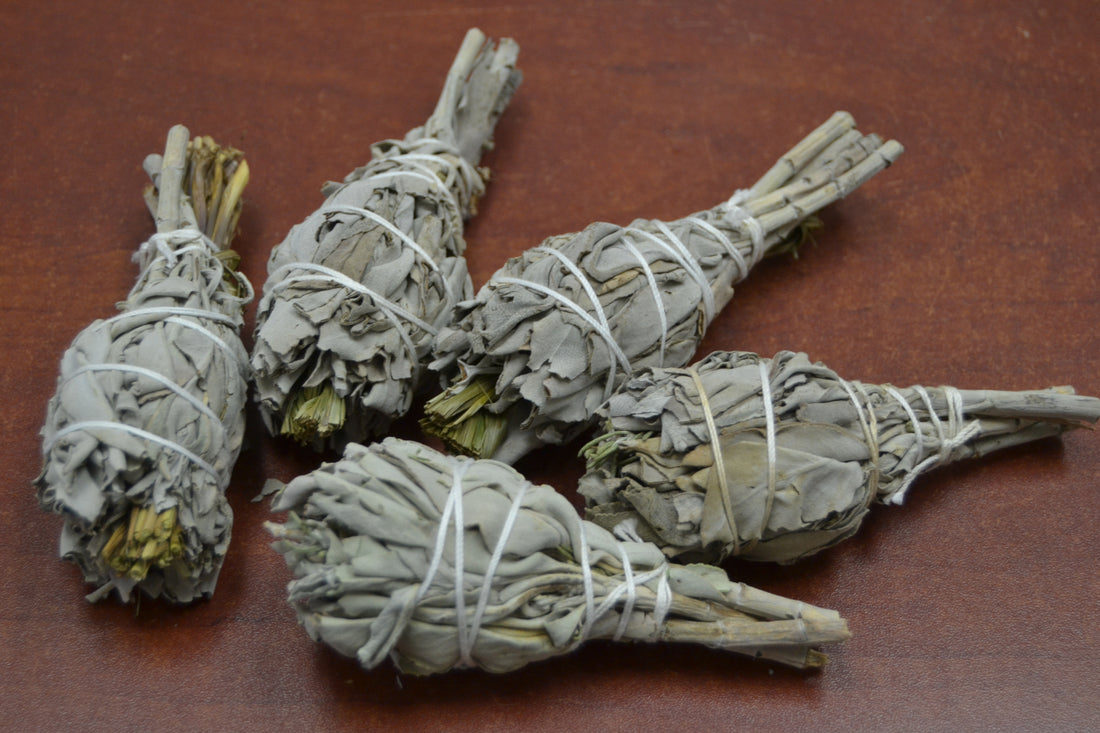 Set of five white mini sage and sweetgrass bundles for smudging, from Grey Aphrodite, displayed on a neutral background.