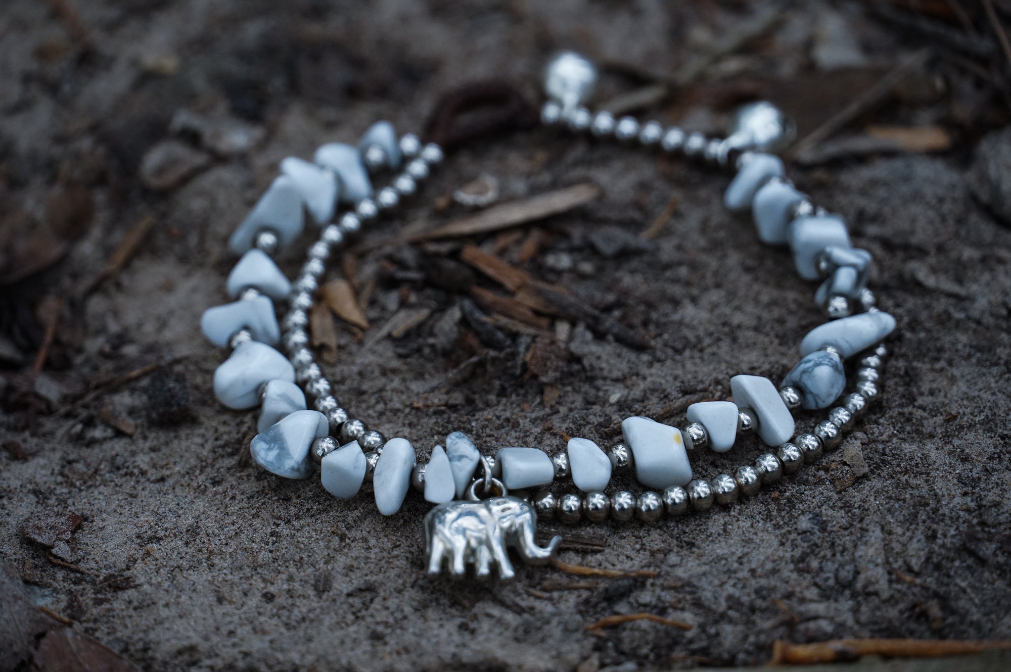 Silver stone bracelet featuring boho elephant charms from Tan Smokey, showcasing intricate design and natural gemstone details.