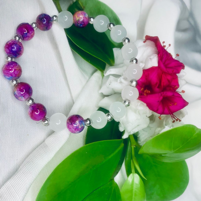 White and purple stone stretch bracelet with silver spacers by Tan Saffron, featuring smooth oval gemstones on a flexible band.