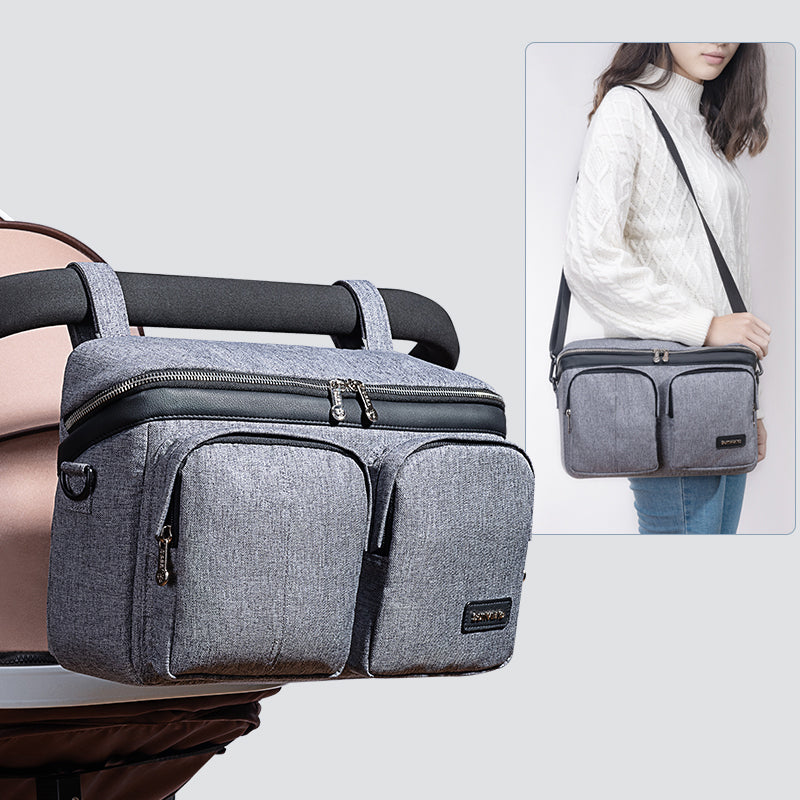 Maroon Chronos stroller organizer caddy bag with multiple compartments, attaching to a stroller for convenient parent and accessory storage.