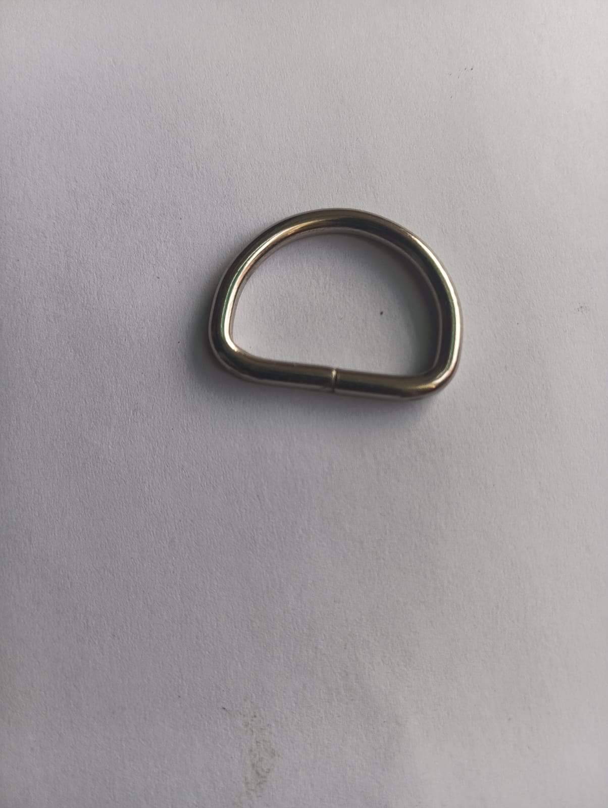 Rose Broadleaf nickel-plated D-ring ring with a sleek, modern design, showcasing a polished finish on a white background.