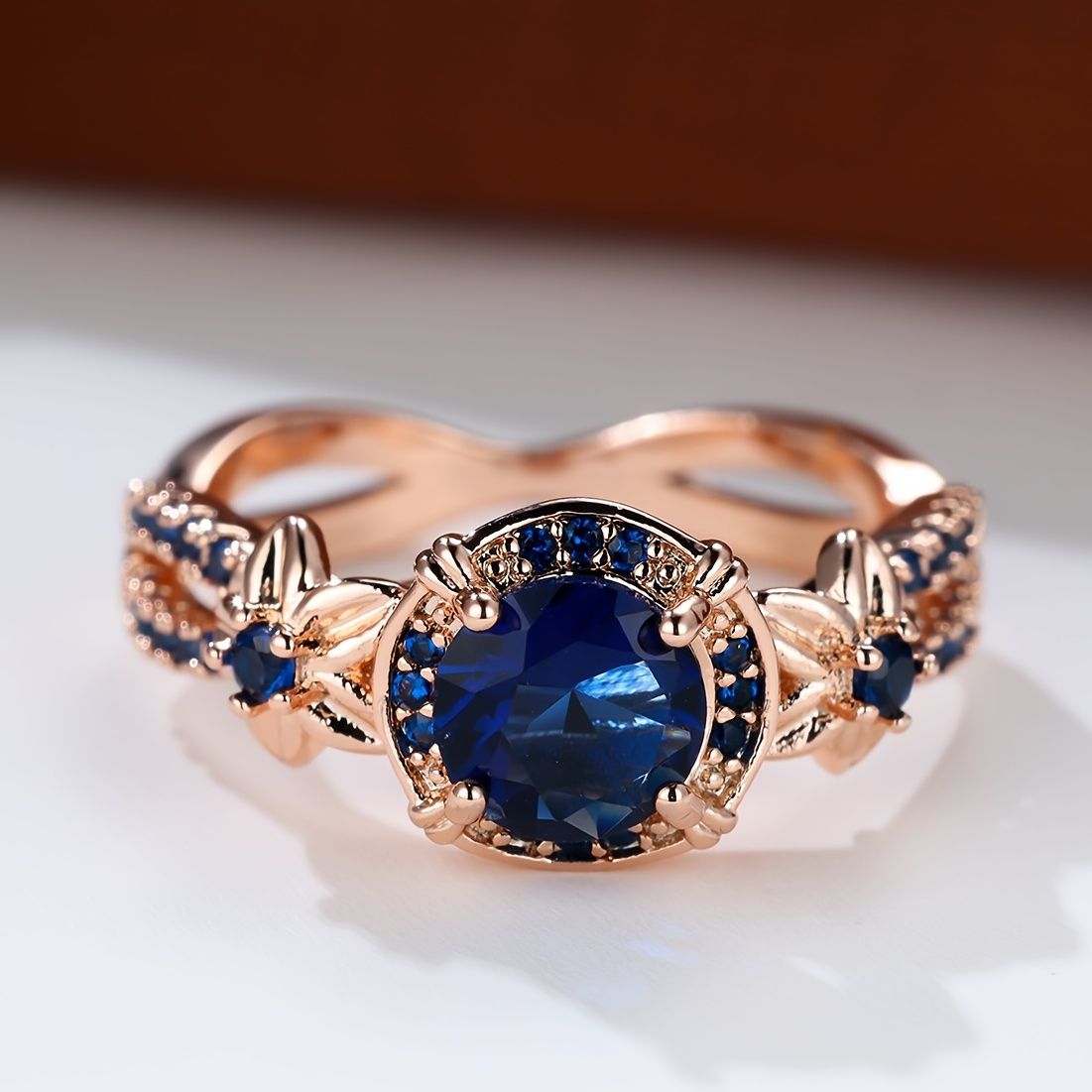 Carmine Medusa sapphire ring featuring a polished silver band with a central blue sapphire gemstone.