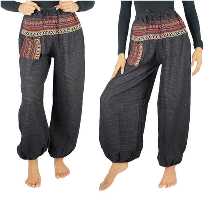 Tan Smokey cotton women’s tribal boho pants with a relaxed fit and colorful ethnic patterns, perfect for a hippie-inspired look.