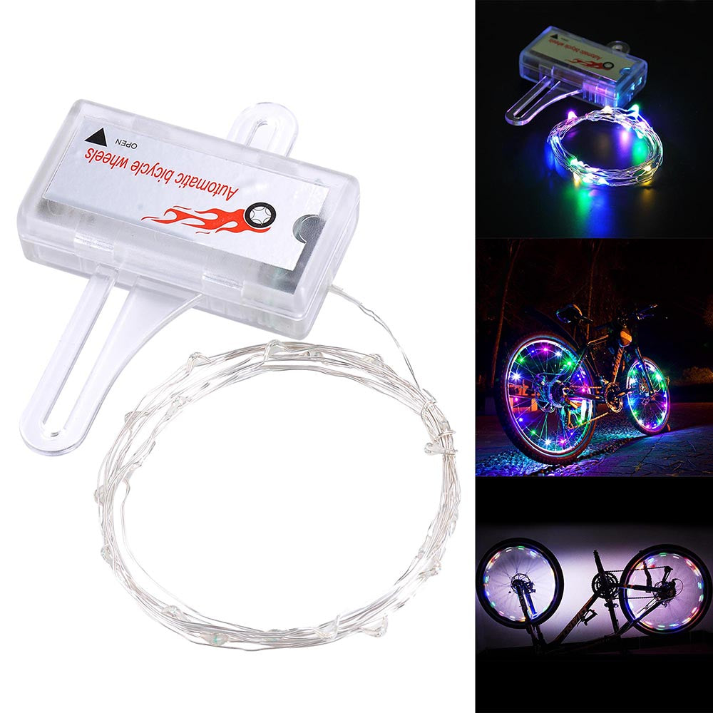 Colorful mini LED bike wheel spoke light by Lilac Milo, illuminating bicycle spokes during biking adventures.