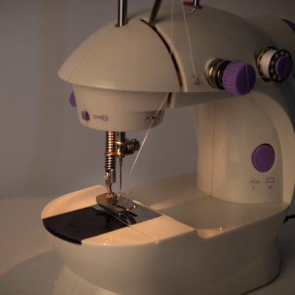 Lilac Milo portable desktop household sewing machine with extension table for home sewing projects, compact and easy to use.