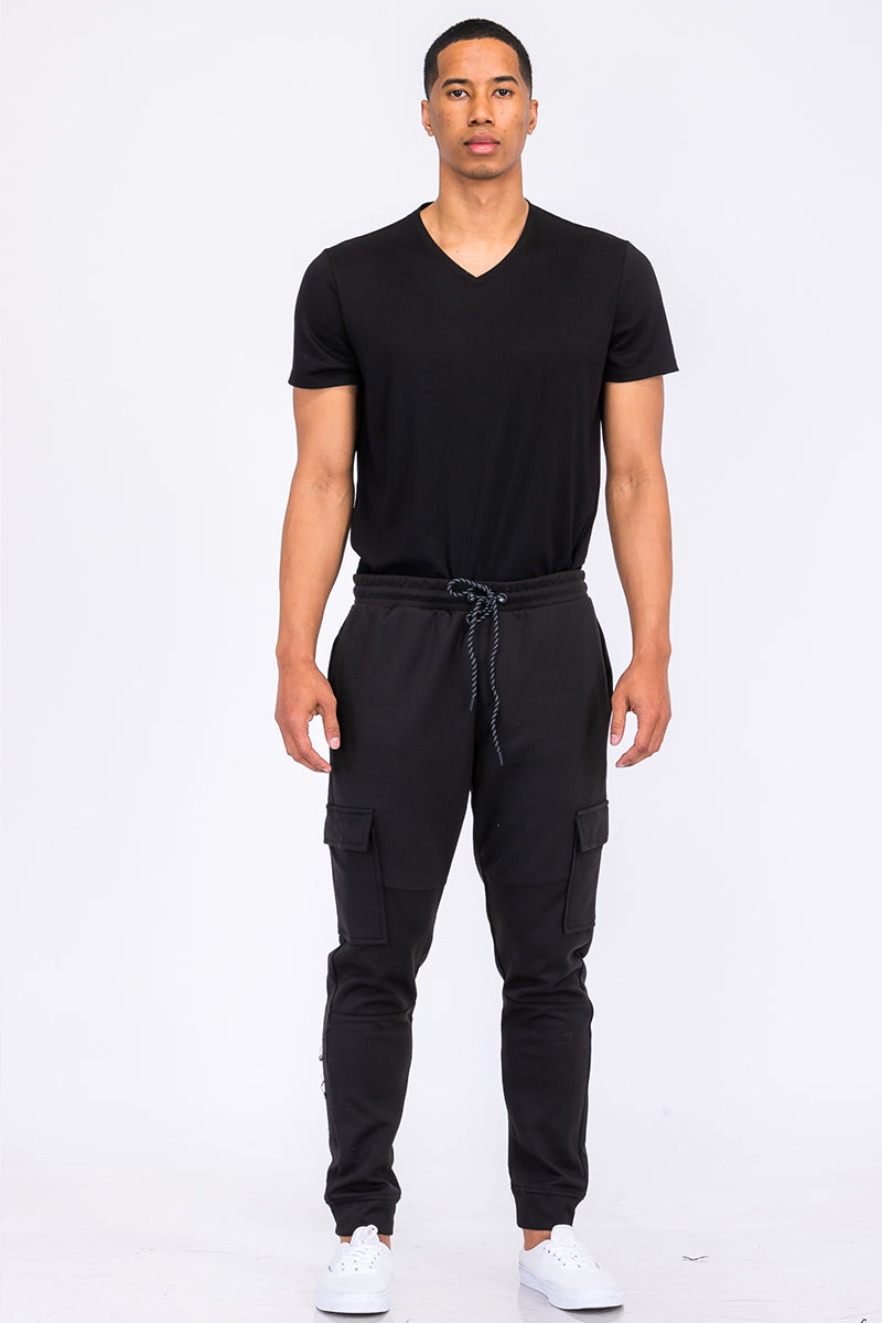 Light gray cotton blend cargo joggers from Lime Milo featuring multiple pockets and a relaxed fit.
