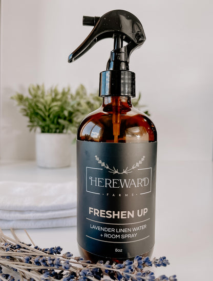 Periwinkle Poplar Freshen Up Linen and Room Spray for bathroom, with a sleek bottle and fresh floral scent visible in the image.