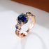 Carmine Medusa sapphire ring featuring a deep blue gemstone set in a silver band with intricate detailing.