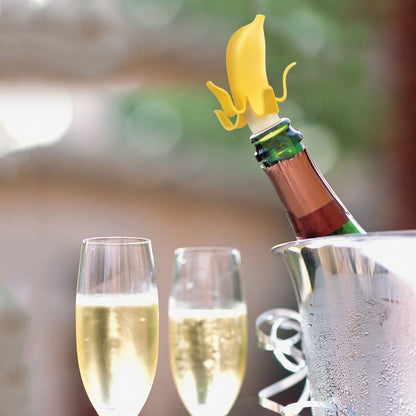Fuchsia Molly Top Banana Wine Stopper in clear glass with a banana shape, designed to seal wine bottles effectively.