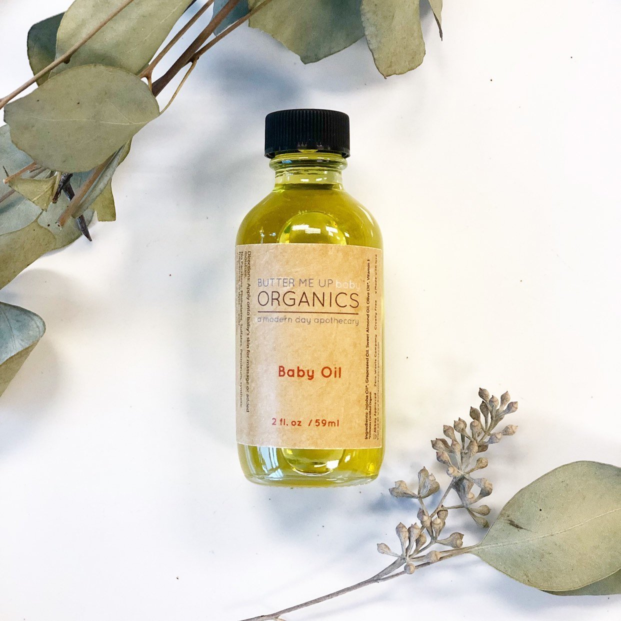White Smokey Organic Gentle Baby Oil bottle with soft, natural skincare packaging and a gentle, soothing design.