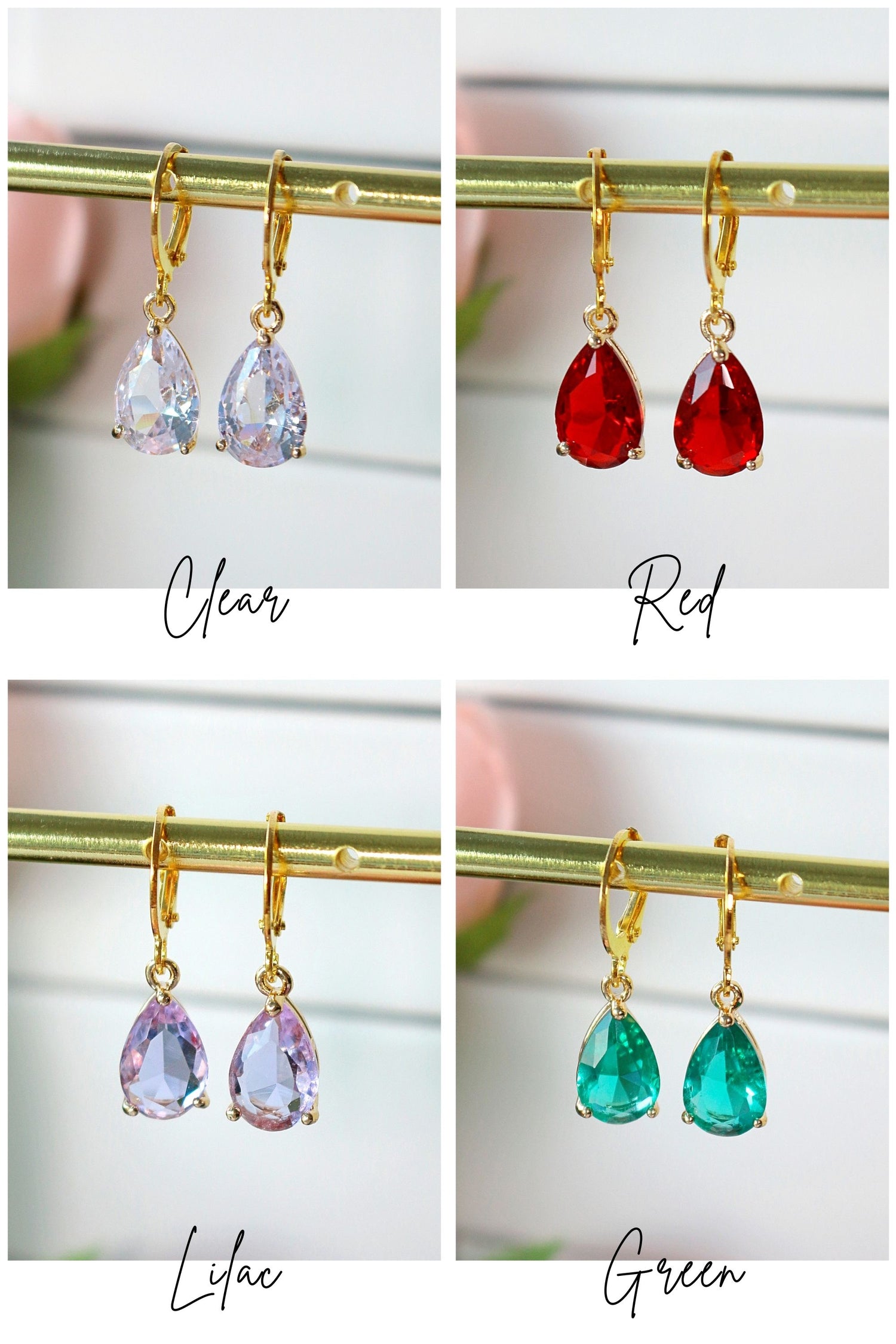 Ultramarine Birch 18K rainbow teardrop hoop earrings featuring colorful, polished gold hoops with vibrant rainbow accents.