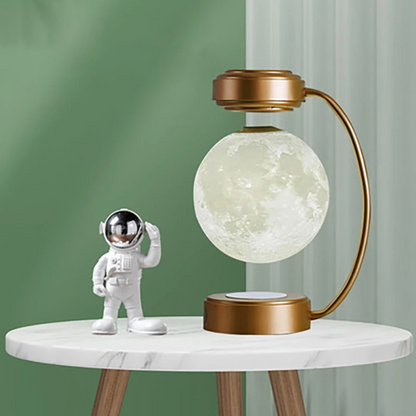 Teal Simba Creativity Magnetic Levitation Moon Lamp with LED lights, rotating and dangling in a sleek tech accessory design.